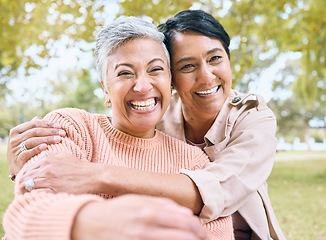 Image showing Couple of friends, seniors and portrait hug in nature park, grass garden and relax environment for profile picture. Smile, happy women and bonding retirement elderly in love embrace for social media