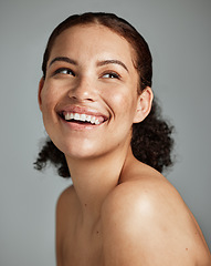 Image showing Skincare, beauty and face of woman in studio isolated on a gray background. Makeup cosmetics, thinking and happy young female model with glowing, healthy and flawless skin after spa facial treatment