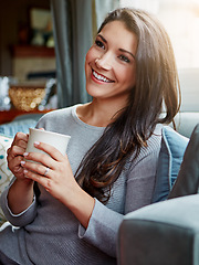 Image showing Relax, coffee and woman on sofa, thinking and young female in living room, rest and weekend break. Lady, girl on couch and tea for peace, happiness and lounge for rest, calm and cheerful with ideas