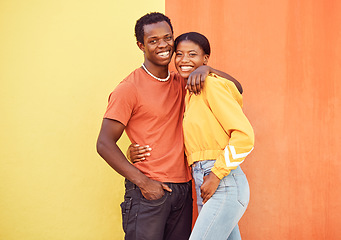 Image showing Black couple, youth and fashion with gen z, hug and together with color and portrait against wall background. Black man, black woman and young with trendy streetwear, mockup and marketing in Nigeria.