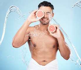 Image showing Skincare, beauty and water splash, man with fruit for vitamin c facial detox for healthcare, natural healthy skin and smile. Water, wellness and sustainability, organic luxurycleaning and grooming.