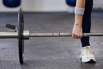 Image showing Barbell, woman hands and weightlifting exercise for fitness, workout and sports challenge in gym. Closeup female athlete, body builder and heavy weights for deadlift, wellness and power