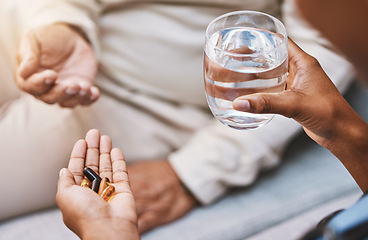 Image showing Hands of nurse with patient for pills, water and medication in nursing home for wellness, healthcare and prescription. Doctor, medical care and health worker with vitamins, supplements and treatment