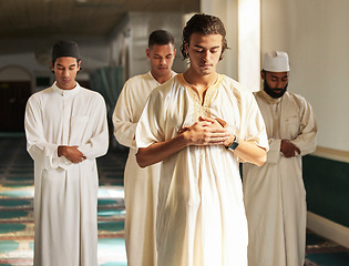 Image showing Men, mosque and muslim prayer to Allah for religion, ramadan kareem and worship of arabic culture. Group of people praying with islamic imam to God with holy dua, spiritual focus and peace in Qatar