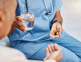 Image showing Pills, water and hands of nurse with patient in nursing home for wellness, healthcare and prescription. Doctor, medical care and health worker with vitamins, supplements and medication treatment