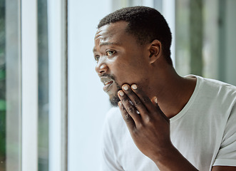 Image showing Skincare, black man and acne stress at mirror in home bathroom with worried and confused face. Unhappy man checking pimple and blackhead problem in reflection with morning grooming routine.