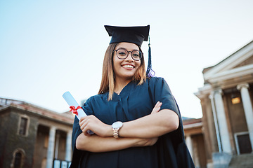 Image showing Portrait, graduation and education with a student woman holding a diploma or certificate outdoor as a graduate. Study, goal or unviersity with a female pupil standing outside for scholarship success