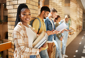 Image showing University, hallway and portrait of black woman and students standing in row together with books before class. Friends, education and future learning, girl in study group on campus in lobby for exam.