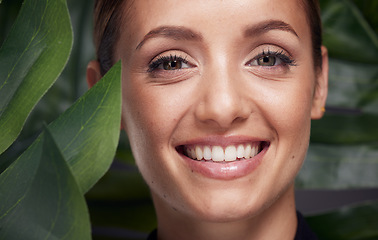 Image showing Beauty, skin and face with leaf and woman, skincare with nature aesthetic, natural cosmetics and facial portrait against studio background. Smile, glow with organic cosmetic treatment and wellness.