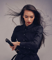 Image showing Samurai, ninja and woman with sword in studio isolated on a gray background. Face, sports and martial arts meditation of young female warrior holding blade ready for workout, training or exercise