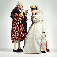 Image showing King man, queen and argue in studio with anger, frustrated and crying in relationship, theater and drama. Medieval royal couple, fight and conflict conversation in renaissance, stress and woman cry