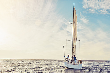 Image showing Couple sailing on yacht, adventure and travel with nature, luxury vacation on the ocean for summer holiday. Wealthy people out at sea, lifestyle with blue sky, romantic getaway with seascape mockup