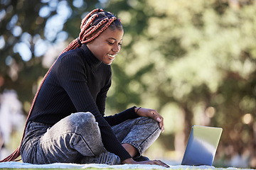 Image showing Black woman, laptop and relax outdoor picnic for college studying, happy learning and digital education. Nature park, young African girl smile and reading university communication online in sunshine