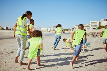 Image showing Woman and group of children cleaning beach for volunteering, community and charity with earth day, climate change and education. Friends, teacher volunteer and recycle plastic for pollution learning