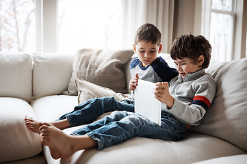 Image showing Boys, bonding or tablet for movie streaming, social media, or esports gaming on family home sofa or living room. Kids, brothers or children on digital technology on education learning support or help