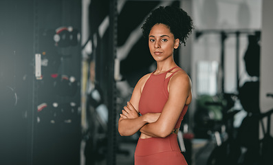 Image showing Black woman, fitness and coach with arms crossed for workout, training or exercise standing in the gym. Portrait of a confident African American female sports instructor with vision for healthy body