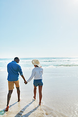 Image showing Beach, walking and back of black couple holding hands, travel and enjoy outdoor quality time together. Ocean sea water, blue sky mock up or freedom peace for bonding people on Jamaica holiday mockup