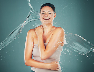 Image showing Woman, cosmetics and water splash for wellness, body care and hygiene on studio background. Young female, lady or cleaning for grooming routine, luxury and aesthetic for hydration, healthcare and wet