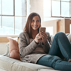 Image showing Thinking, phone and woman relax on a sofa, happy and smile while chatting online in her home. Idea, girl and smartphone app for online dating, social media and streaming while resting in living room