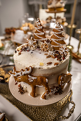 Image showing Christmas cake decorated with gingerbread cookies