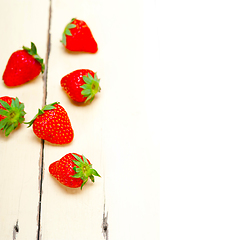 Image showing fresh organic strawberry over white wood