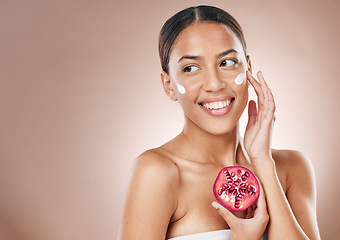 Image showing Face, pomegranate cream and woman, beauty facial and wellness with skincare, healthy skin and cosmetic mockup. Glow, shine and vegan moisturizer, fruit and smile for facial with studio background