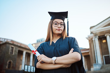 Image showing Graduation, education and portrait of woman at university, college and academic campus with diploma certificate. Celebration, graduate ceremony and girl student with success, victory and achievement