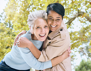 Image showing Senior women, portrait and laughing hug in nature park, garden or relax environment in retirement, support or trust. Smile, happy friends and bonding elderly in embrace, comic activity or funny joke