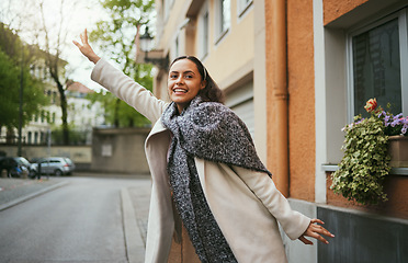 Image showing Tourist, travel and hailing taxi in city, street or New York road in transportation, traveling and urban commute. Smile, happy woman and student stopping cab, lift or sightseeing bus in town location