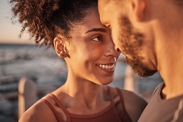 Image showing Black couple, smile and hug with forehead embracing relationship, compassion or love and care by the beach. Happy man and woman touching heads smiling in happiness for support, trust or romance