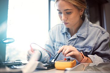 Image showing Engineer, student and woman repair electronics for science project. Learning, education and female technician with technology testing microchip, gadget or circuits for electricity with electric meter