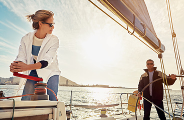 Image showing Boat, couple and steering wheel for sea travel, retirement wealth and holiday investment hobby. Luxury sailing, rich and fun marriage people on ocean or lake water with outdoor sunglasses in sunshine