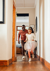 Image showing Family, father and daughter running in a house, smile and happy while playing game together. Princess, girl and parent having fun in home, ballerina and crazy indoors with happiness, bond and joy