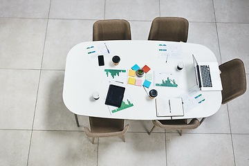 Image showing Empty office, laptop or documents in digital agency space, advertising startup or creative small business. Furniture, top view or paper for research in office building with table, desk and chairs