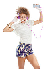 Image showing Happy, dancing and woman portrait of a model with music, phone radio and web song. White background, black woman and happiness of isolated person streaming a podcast with headphones and mobile