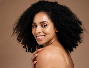 Image showing Happy woman, afro hairstyle and face skincare on studio background in self love hug, healthcare wellness grooming or body dermatology. Portrait, smile or beauty model, natural curly style and makeup