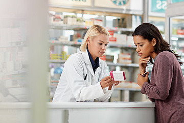 Image showing Consulting customer and focus of store pharmacist at counter for expert help and customer service. Pharmaceutical advice and opinion of worker helping girl with medicine information at pharmacy.