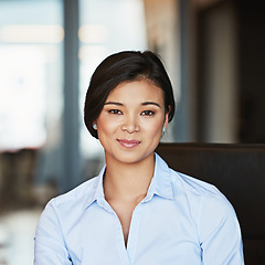 Image showing Portrait, young and Asian business woman working in a modern office and smiling. Happy, confident and female entrepreneur or insurance professional in Bangkok on a webcam at a company