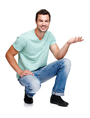 Image showing Portrait, space and hand gesture with a man in studio isolated on a white background for marketing or advertising. Product, branding and mock up with a handsome young male posing to promote a brand