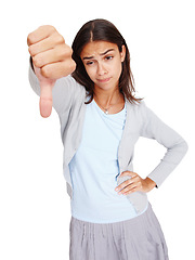 Image showing Thumbs down, bad and young woman in studio with a stylish, trendy and casual cool outfit. Unhappy, upset and female model with a negative or disagree hand sign or gesture isolated by white background