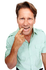 Image showing Portrait of a man biting his finger in studio with a nervous, worried or terrified facial expression. Crazy, worry and uncertain mature male model with a fear gesture isolated by a white background.