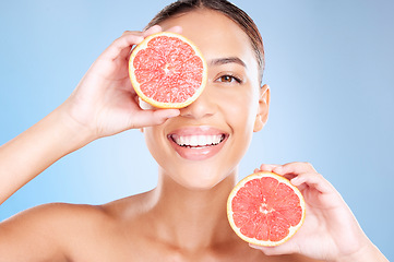 Image showing Grapefruit, skincare and wellness of a woman with fruit, cosmetics smile or healthcare face glow. Model, happy or girl with fruits for health, cosmetic and healthy aesthetic facial beauty with food