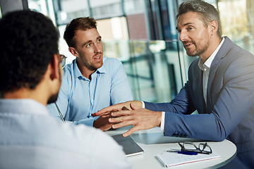 Image showing Discussion, planning and business men in meeting for marketing strategy, ideas and work project. Teamwork, communication and group of male workers at desk talking, in conversation and brainstorming