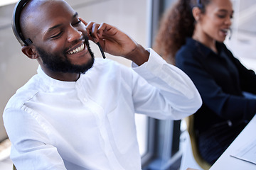 Image showing Black man, face and smile with headset in call center, contact us with CRM and phone call with client. Communication, customer service with telemarketing and tech support, happy man on help desk