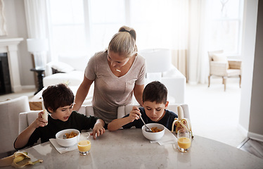 Image showing Eating, happy and mother with children for breakfast nutrition and food in the morning. Hungry, together and boy kids with fruit, juice and love from mom during a snack or lunch at the table