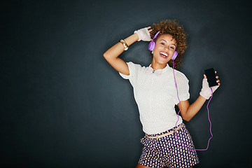 Image showing Phone music, dance portrait and mock up black woman listening to song, audio podcast or radio sound with fun energy. Studio mockup, dancing girl and retro student isolated on dark background