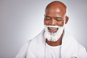 Image showing Face, shaving cream and happy black man with beard and smile, skincare treatment on grey background. Health, mock up and facial hair, mature man morning shave foam with space for product placement.