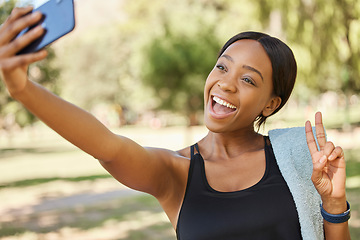 Image showing Selfie, peace and park with a sports black woman taking a photograph outdoor during fitness or exercise. Social media, towel and nature with a female athlete posing for a picture while training