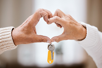 Image showing Senior couple, heart hands and keys for new home, success and bonding with love, care and support. Closeup, elderly people and hand sign together in house, apartment or home with excited homeowner