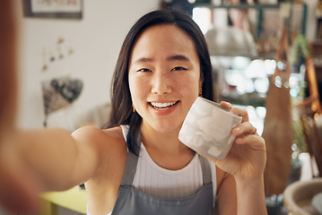 Image showing Selfie, ceramic art and creative asian woman smile in pottery studio or worship for mug product design, culture creativity and artistic development. Artist woman, happy portrait and mud sculpture